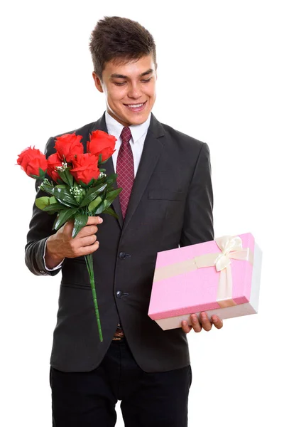 빨간 장미 및 보고 하는 동안 웃 고 젊은 행복 한 사업가 — 스톡 사진