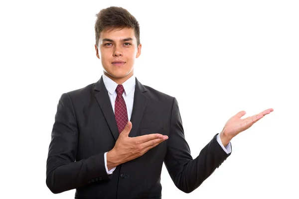 Businessman showing something and looking at camera — Stock Photo, Image