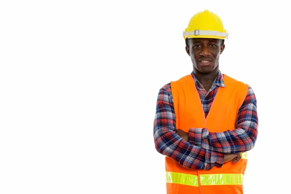 Studio shot van jonge gelukkig zwarte Afrikaanse man bouwvakker — Stockfoto