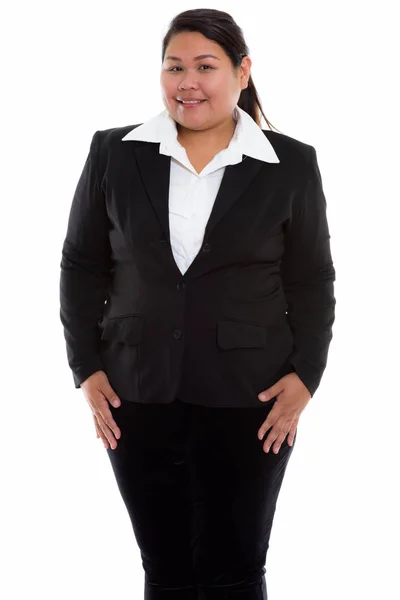 Studio shot of young happy fat Asian businesswoman smiling while — Stock Photo, Image