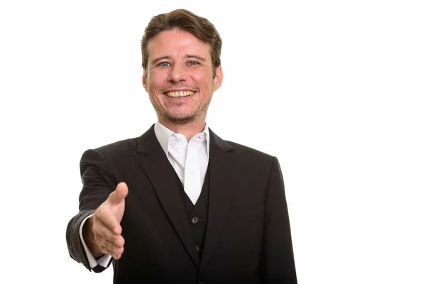 Щасливі кавказьких бізнесмен, даючи рукостискання а посміхаючись — стокове фото