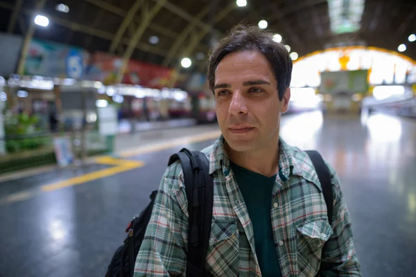 Handsome Persian tourist man at the railway station in Bangkok,