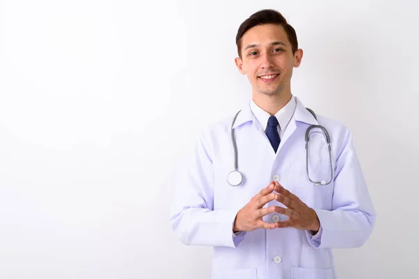 Estúdio tiro de jovem médico homem feliz sorrindo com os dedos inter — Fotografia de Stock