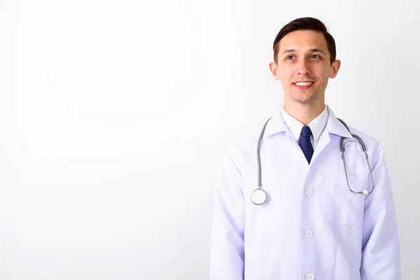 Estudio Tiro Joven Feliz Hombre Médico Sonriendo Pensando Mientras Mira —  Fotos de Stock