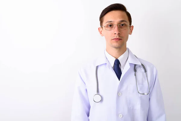 Close up of young handsome man doctor wearing eyeglasses against — Stock Photo, Image