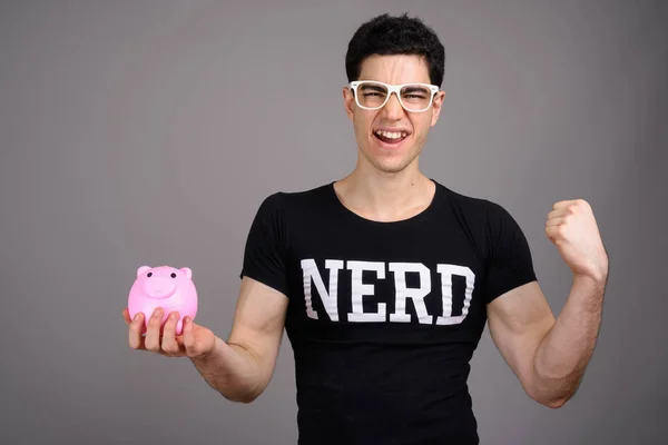 Studio Shot Young Handsome Nerd Man Wearing Eyeglasses While Holding — Stock Photo, Image