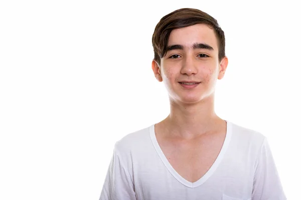 Studio shot of young happy Persian teenage boy smiling — Stock Photo, Image