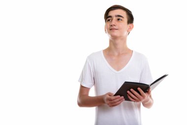 Kitap w tutan genç yakışıklı İranlı genci stüdyo vurdu