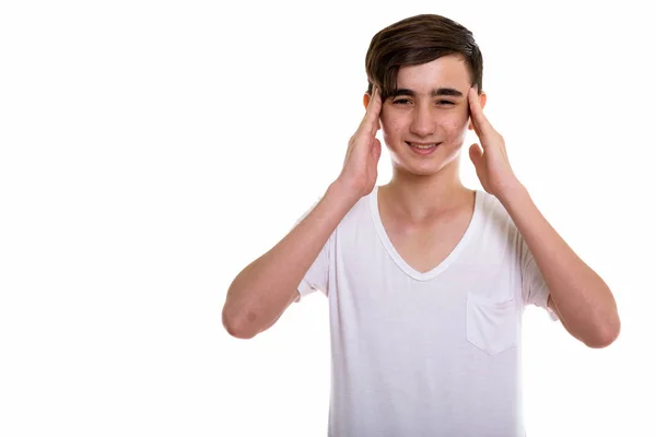 Studio shot de jeune adolescent persan stressé ayant mal à la tête — Photo