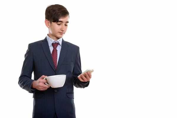 Studio shot of young handsome Persian teenage businessman holdin — Stock Photo, Image