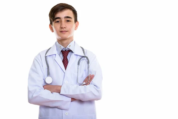 Studio shot of young handsome Persian teenage doctor with arms c — Stock Photo, Image