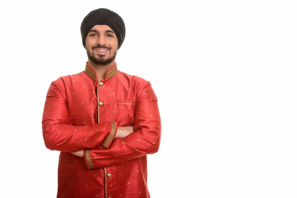 Jovem feliz indiana Sikh sorrindo vestindo roupas tradicionais — Fotografia de Stock