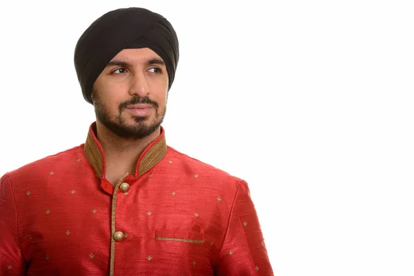 Jovem bonito indiana sikh pensamento enquanto vestindo tradicional cl — Fotografia de Stock