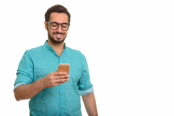 Young happy Indian man using mobile phone — Stock Photo, Image