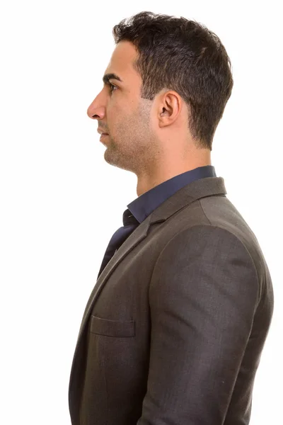 Profilo vista di giovane bell'uomo d'affari persiano in piedi — Foto Stock