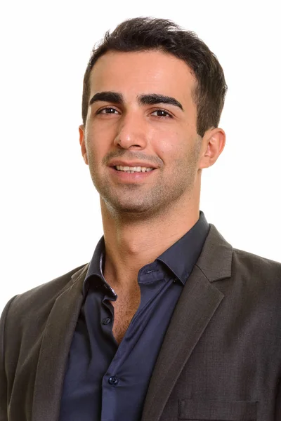 Portrét mladých šťastný perský podnikatel proti bílým pozadím — Stock fotografie