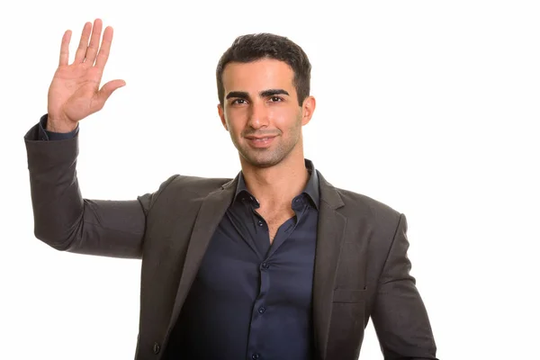 Porträt eines jungen, gut aussehenden persischen Geschäftsmannes vor weißem Hintergrund — Stockfoto
