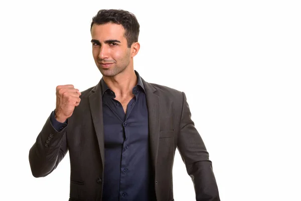 Porträt eines jungen hübschen persischen Geschäftsmannes mit erhobenem Arm — Stockfoto