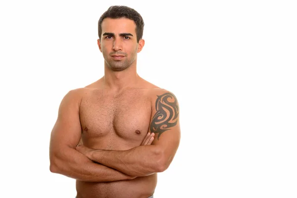 Portrait of young handsome Persian man shirtless with arms crossed — Stock Photo, Image