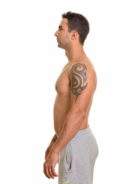 Profile view of young handsome Persian man shirtless — Stock Photo, Image
