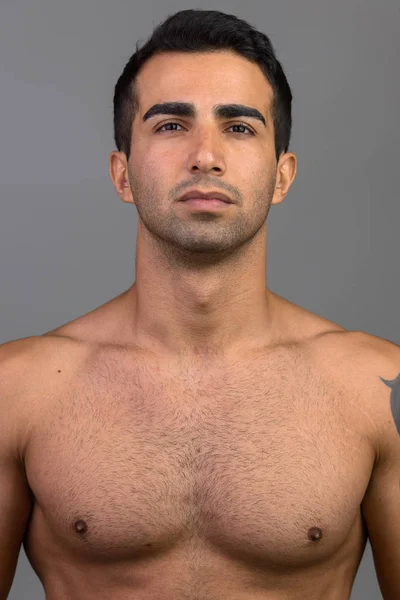 Face of young handsome Persian man shirtless — Stock Photo, Image