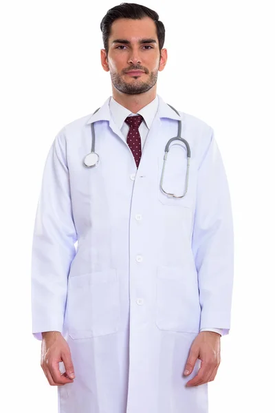 Studio záběr mladý pohledný muž lékař stojící — Stock fotografie