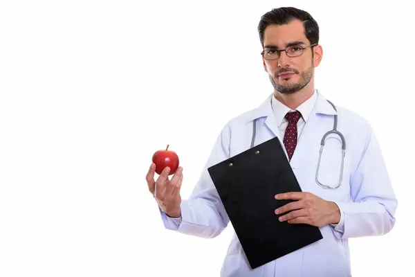 Студийный снимок молодого красивого врача с планшетом и р — стоковое фото