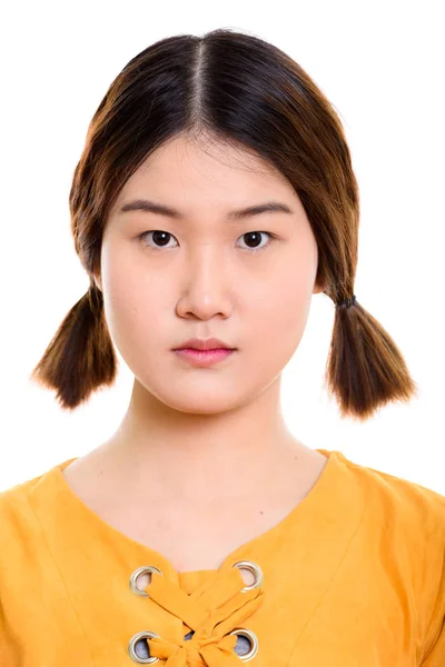 Face of young beautiful Asian woman with pigtails — Stock Photo, Image