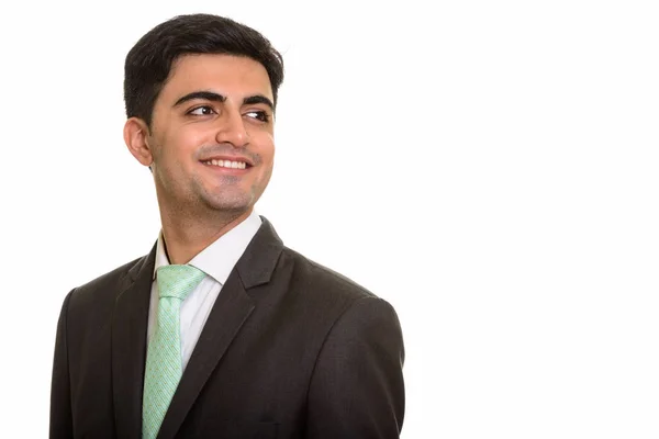 Fiatal boldog perzsa üzletember mosolyogva, és a gondolkodás — Stock Fotó