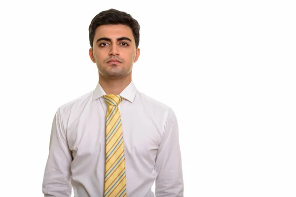 Junger hübscher persischer Geschäftsmann schaut in die Kamera — Stockfoto