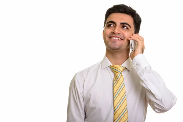 Fiatal boldog perzsa üzletember, mobil telefon, miközben th beszél — Stock Fotó