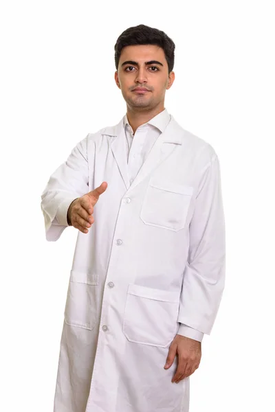Young handsome Persian man doctor giving handshake — Stock Photo, Image