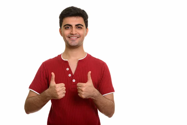 A fiatal boldog perzsa férfi feladja a hüvelykujját — Stock Fotó