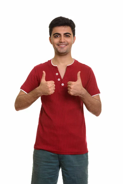 Mladý šťastný perský muž dává palce nahoru — Stock fotografie