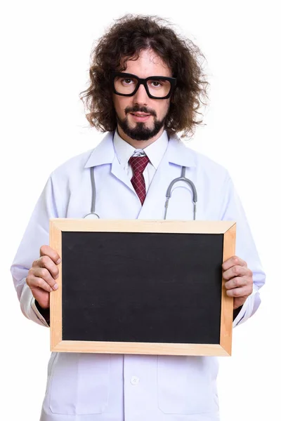 Estúdio tiro de homem bonito médico segurando quadro branco — Fotografia de Stock