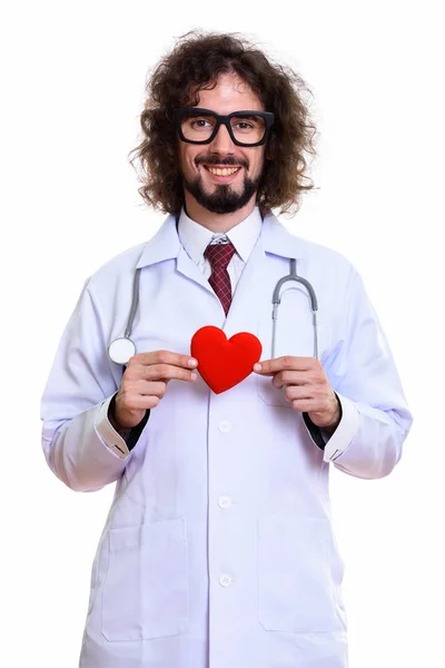 Studio shot of happy man doctor smiling holding red heart with b — Stock Photo, Image