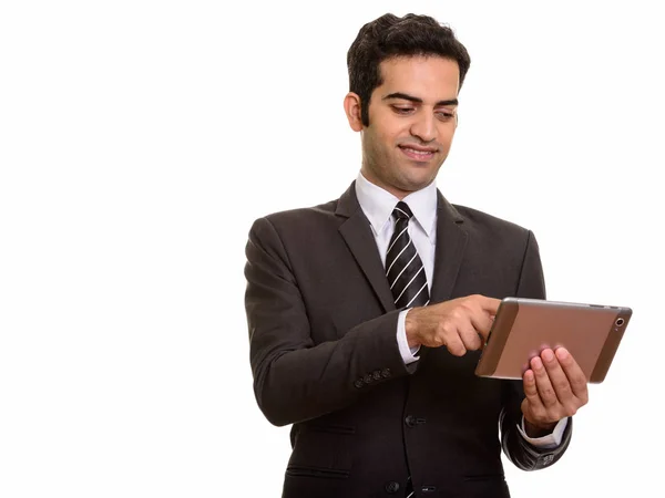 Young happy Persian businessman using digital tablet — Stock Photo, Image