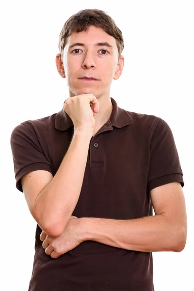 Studio shot of man thinking with hand on chin — Stock Photo, Image