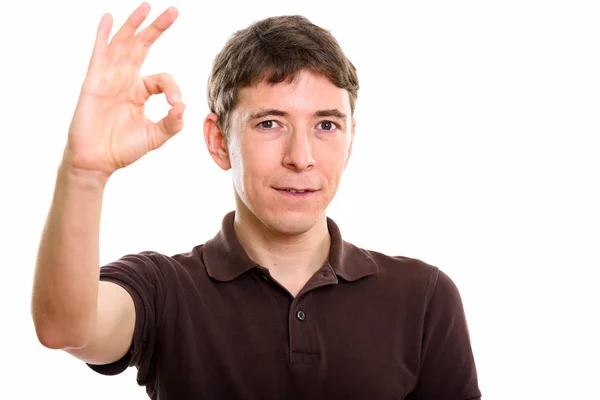 Studio shot of man giving ok sign — Stock Photo, Image