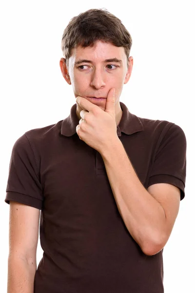 Studio shot of man thinking while looking down — Stock Photo, Image