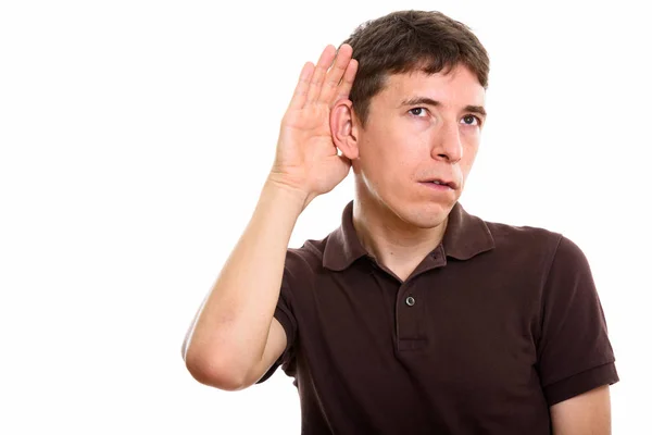 Studio shot of man listening while thinking — Stock Photo, Image