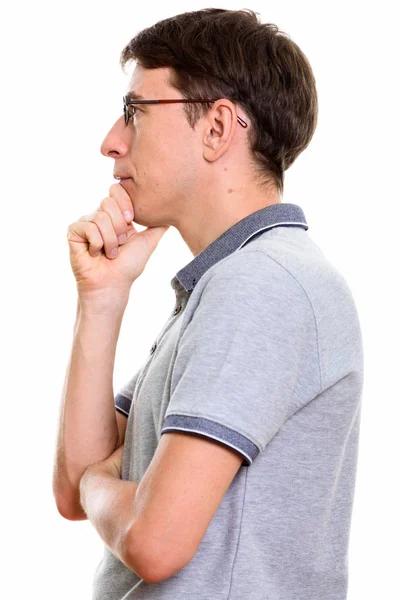 Profile view of man thinking with hand on chin — Stock Photo, Image