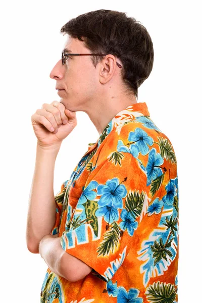 Profile view of tourist man thinking with hand on chin — Stock Photo, Image