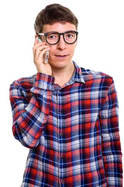 Studio shot of man talking on mobile phone — Stock Photo, Image