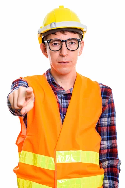 Studio shot of man construction worker pointing finger at camera — Stock Photo, Image