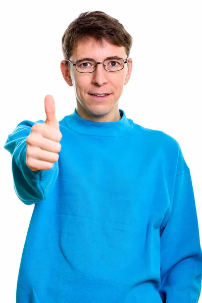 Studio shot of man giving thumb up — Stock Photo, Image