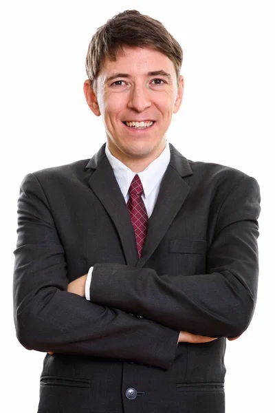 Studio shot of happy businessmansmiling  with arms crossed — Stock Photo, Image