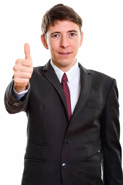 Студійний знімок бізнесмена, що здає великий палець — стокове фото