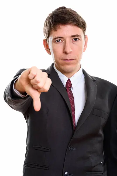 Studio shot of businessman giving thumb down — Stock Photo, Image