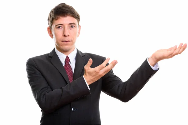 Studio shot of businessman showing or holding something — Stock Photo, Image